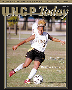soccer player kicking a ball from the cover of the UNCP Today winter 2001 edition