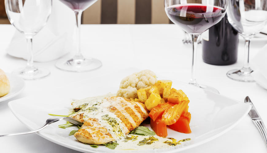 Sample dish with a glass of wine.